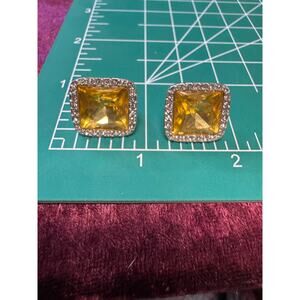 Clip on earrings / yellow stone / silver tone / signed JJG / vintage